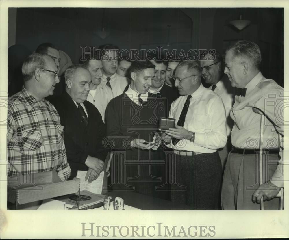 1955 Press Photo Arnie Fischer and others gives Joseph Berte 25 Year Medallion-Historic Images