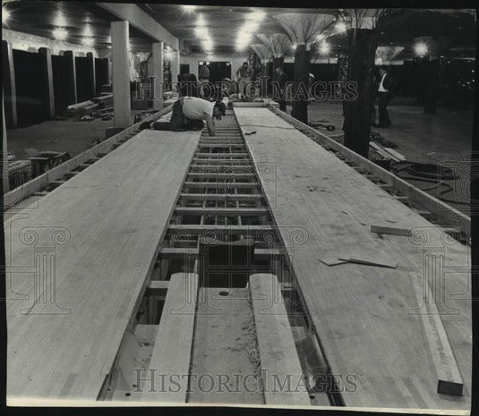 1965, Workmen lay Sentinel Sports-Travel & Boat Show bowling lanes - Historic Images