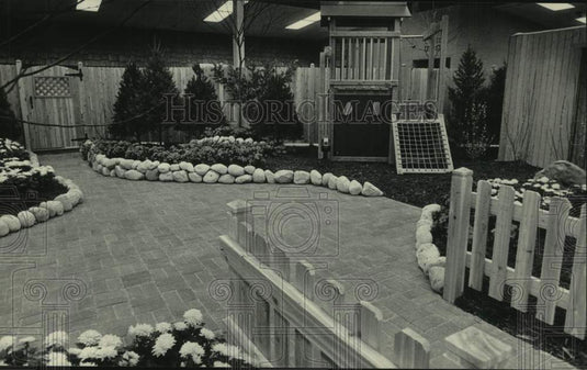 1986 Press Photo Home Show yard with brick patio, fence and flowers - mjc36637 - Historic Images