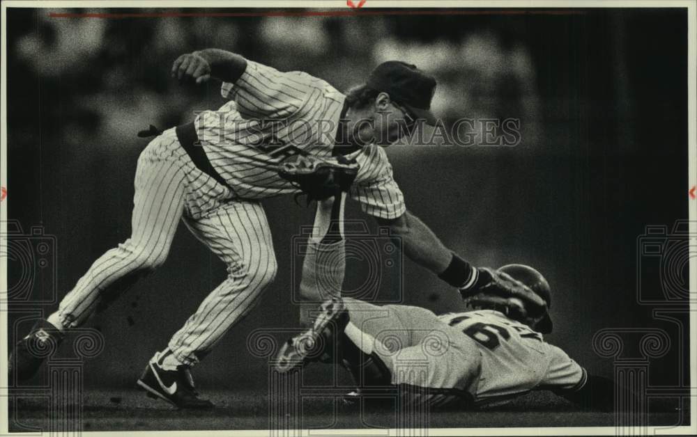 1989 Milwaukee Brewer Jim Gantner tags player out at second base