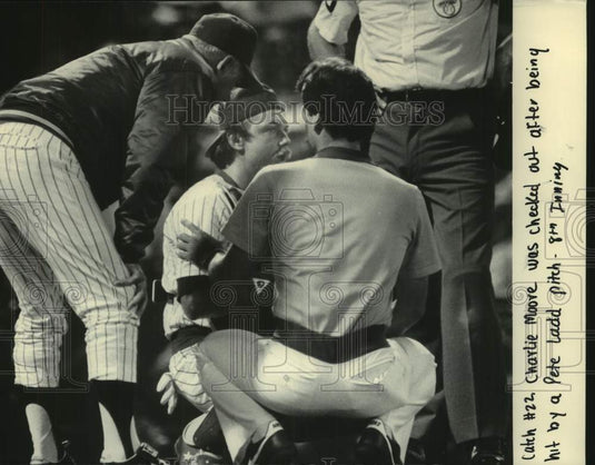 1985 Press Photo Brewers' Charlie Moore was checked after being hit by pitch - Historic Images