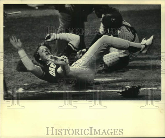 1984 Press Photo A's player Mickey Tettleton scores, as Brewers' catcher misses - Historic Images