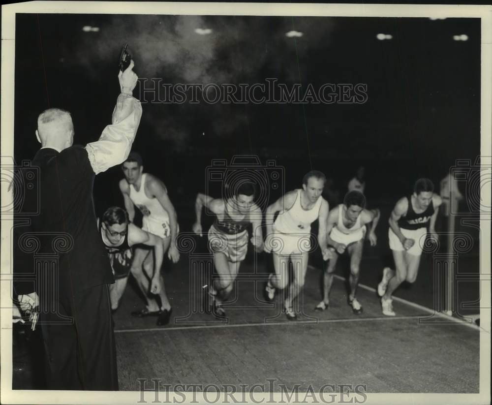 1954 Gun fires and runners start at Milwaukee Journal Meet, Arena - Historic Images