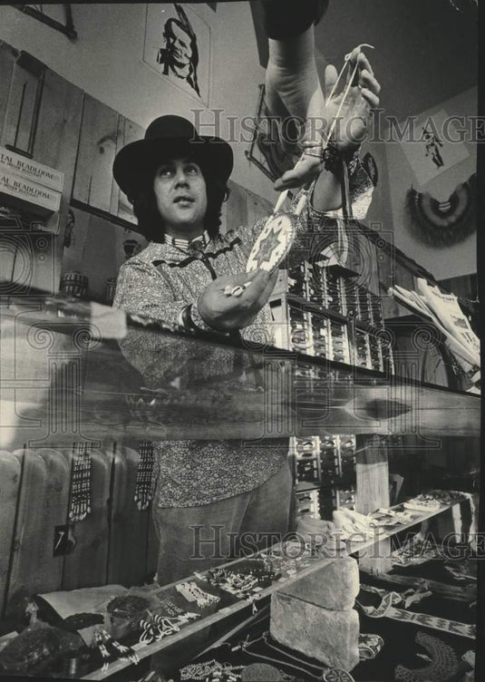 Mike Spuda sells Indian items in Milwaukee store. - Historic Images