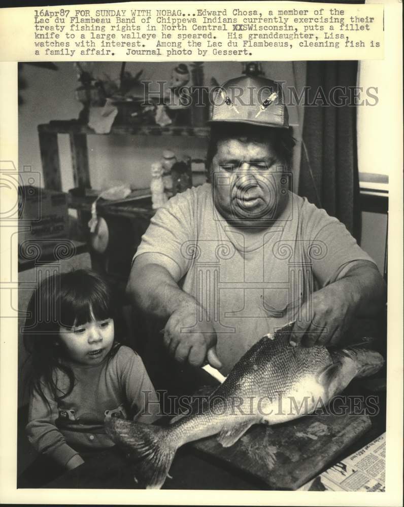 1987 Press Photo Edward Chosa Puts Knife to Large Walleye with Granddaughter - Historic Images