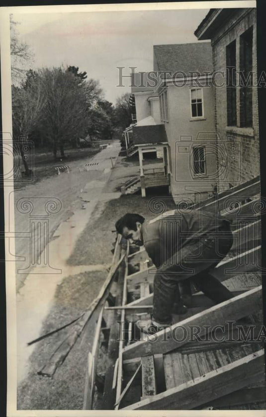 1964, Menominee Indian Wally Peters Jr works on dormitory Neopit, WI - Historic Images