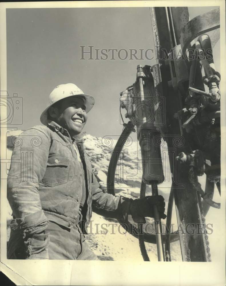 1959, A man works on a natural gas line in southeastern Utah - Historic Images