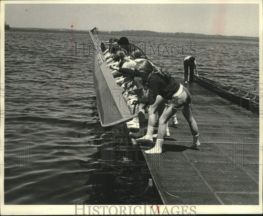 1972 University of Wisconsin crew team members launch practice boat - Historic Images