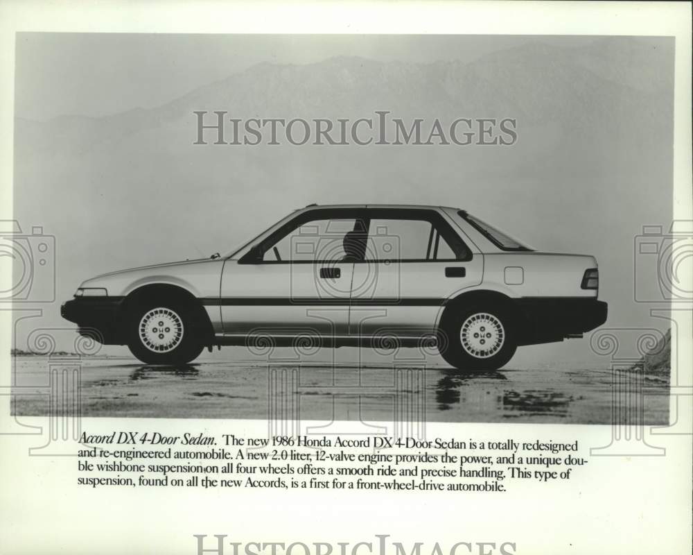 1985 Press Photo 1986 Honda Accord DX 4-Door Sedan in front of a mountain - Historic Images