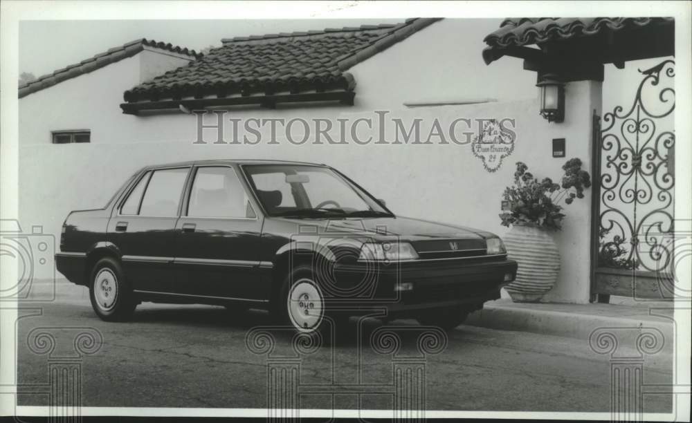 1986 Press Photo 1987 Honda Civic 4-door sedan parked outside a home - mjc38871 - Historic Images