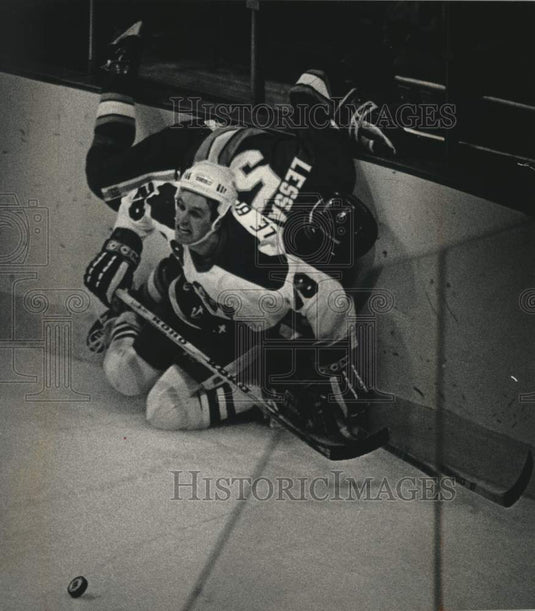 1988 Press Photo Admirals hockey player John Le Blanc watches puck skid away - Historic Images