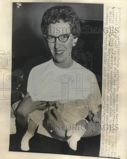 1963, Mrs. Andrew Fischer holding one of her quintuplets - mjc38906 - Historic Images