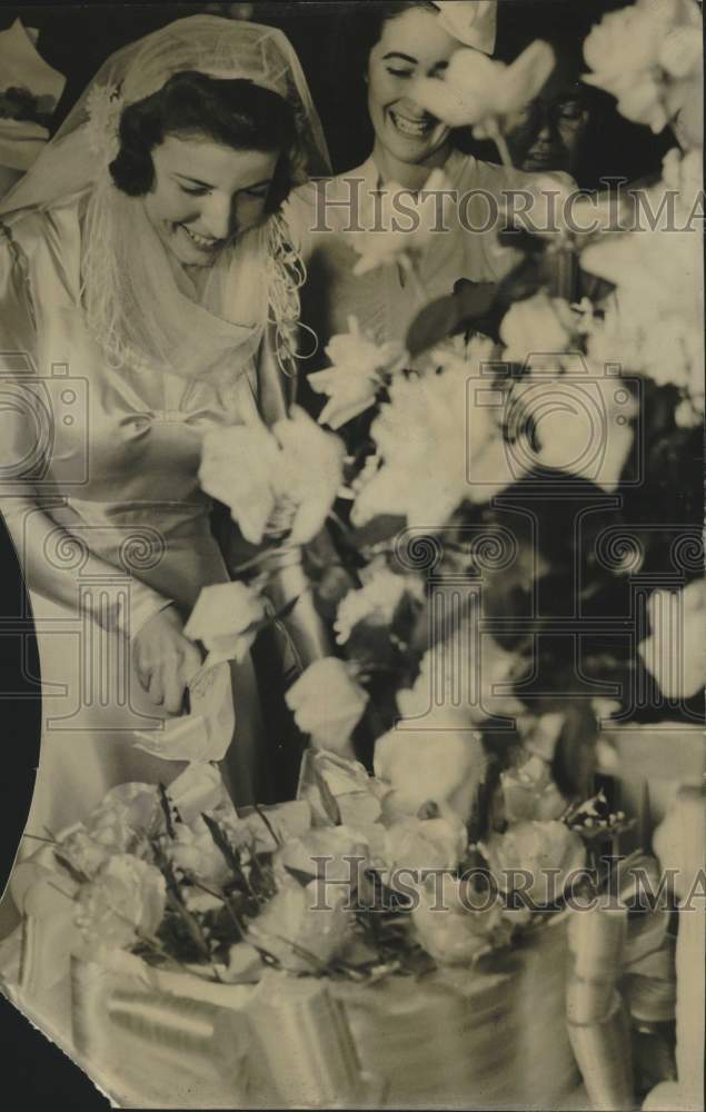 1940, Bride Anne McIntosh receives congratulations at wedding - Historic Images