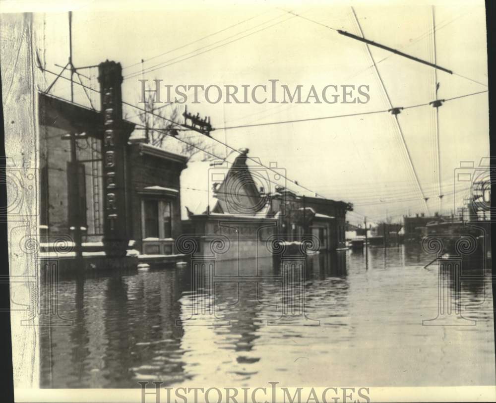 1937, Trolley lines show water depth on a flooded street - mjc39229 - Historic Images