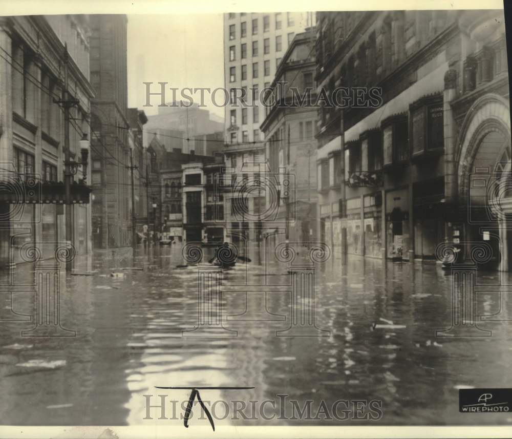 1936, Boater on a flooded street in downtown Pittsburgh - mjc39254 - Historic Images