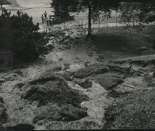 1949 Flower display washed down the slope during storm in Milwaukee - Historic Images