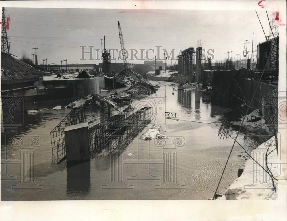 1959, River bed diverted for bridge construction floods in Milwaukee. - Historic Images