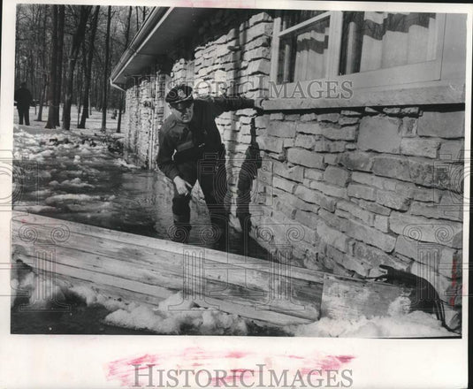 1959, Deputy Daniel Richardson Use Tobaggon as Dam in Franklin - Historic Images