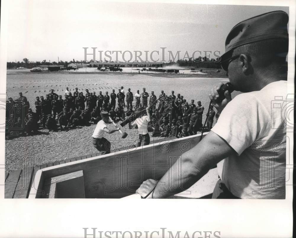 1968, MSgt. Paul McGuire shouts orders to trainers, others, U.S. - Historic Images