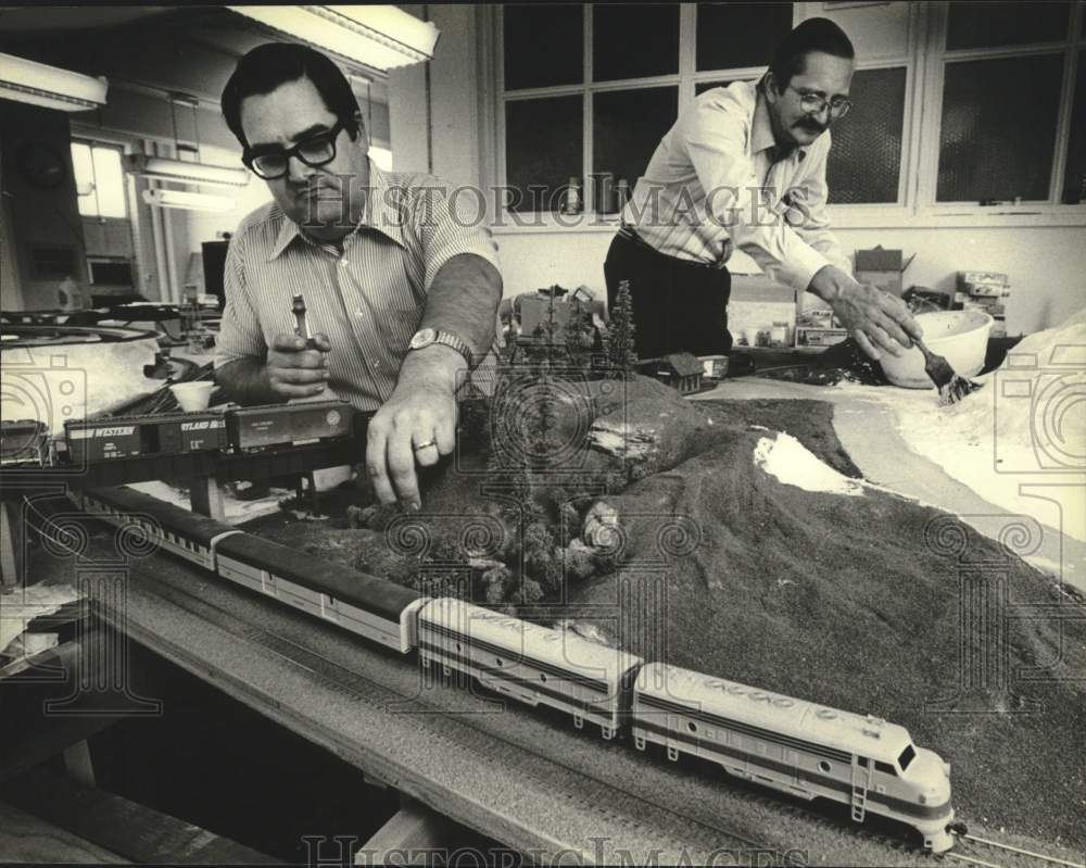1979 Press Photo Editors of Model Railroader Magazine test products they promote- Historic Images