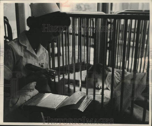 1957, Curtis Weber is checked at Milwaukee Children's Hospital - Historic Images