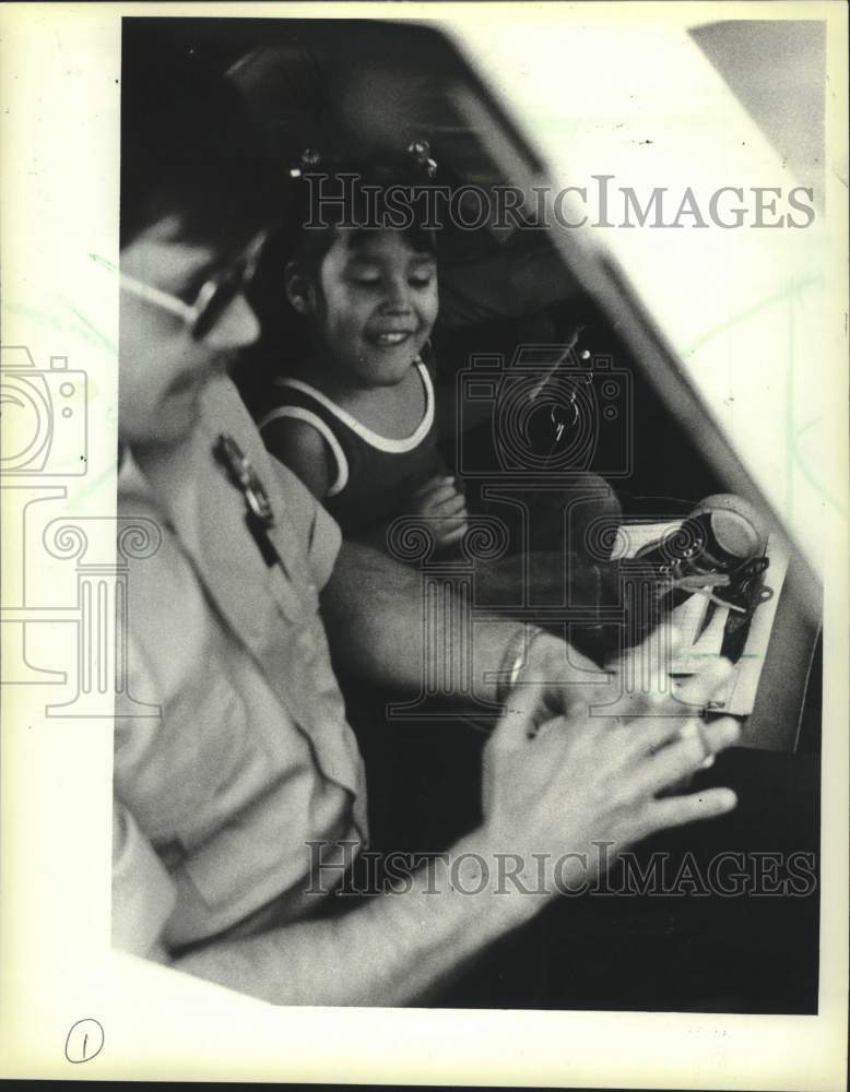 1983 Press Photo Jennifer sat in a Milwaukee police squad car - mjc40292 - Historic Images