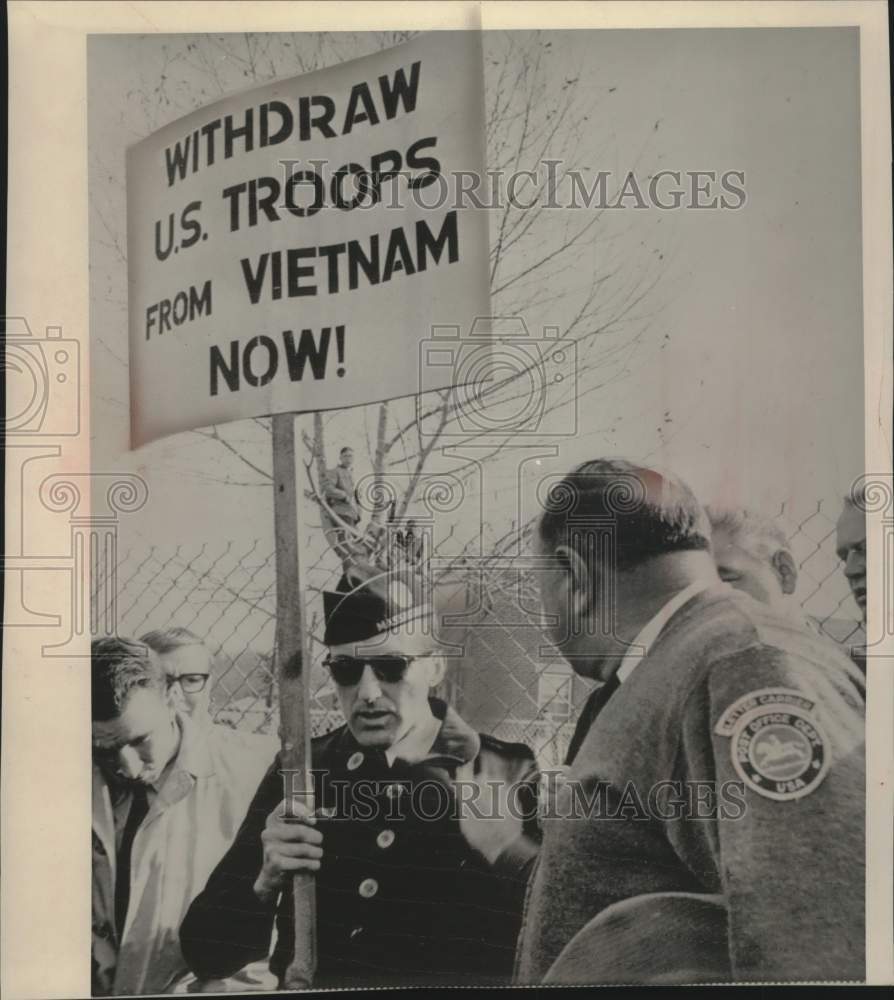 1965, Edgar Cormier rips campaign ribbons from Hollis uniform, Mass. - Historic Images