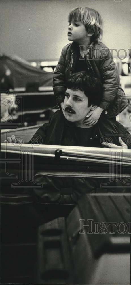 1982 Press Photo Christopher Sanchez and Dad Alexander at Milwaukee Boat Show - Historic Images