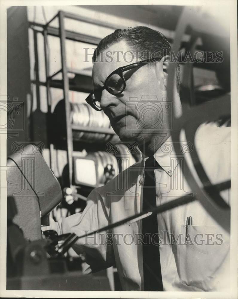 1965, Carl Zimmerman, WITI-TV announcer reviewing film. - mjc40997 - Historic Images