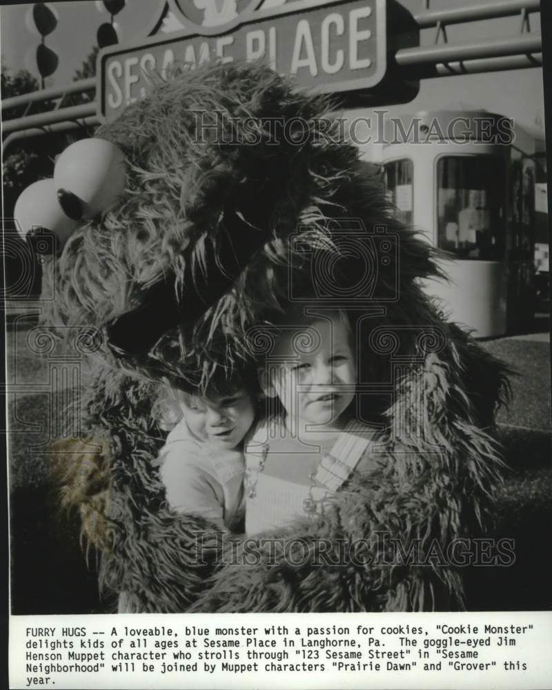 1988 Press Photo "Cookie Monster" hugs children on "Sesame Street" - mjc41061 - Historic Images