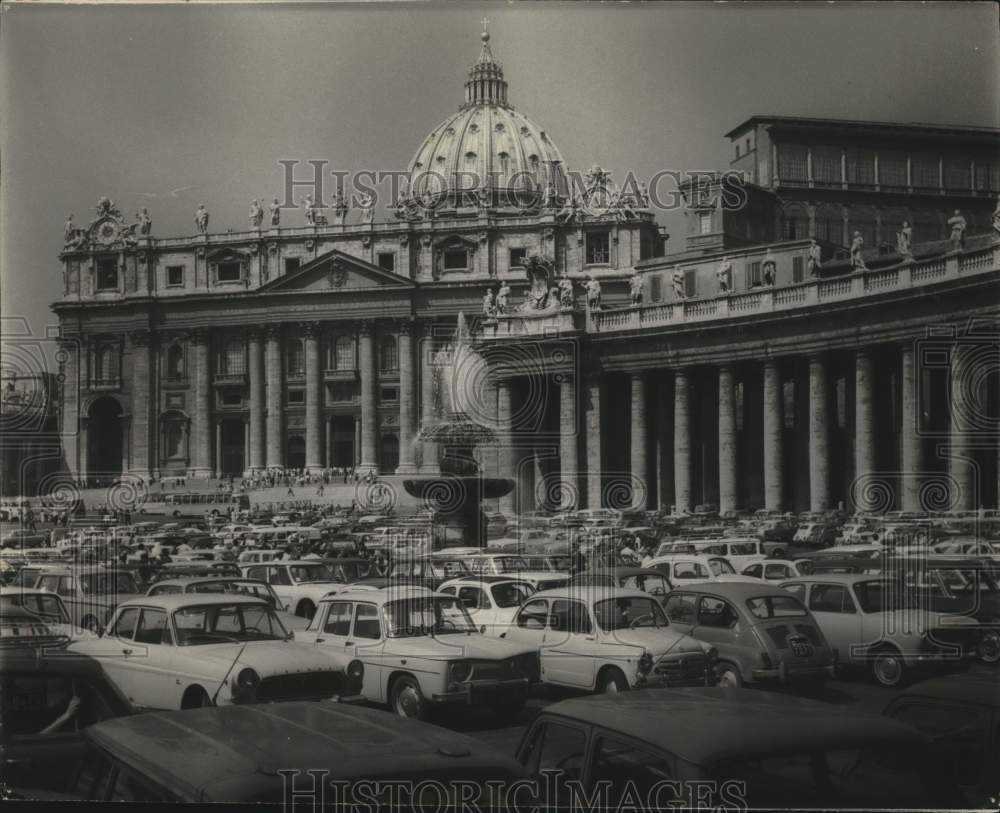 1967 Sea of cars parked at St Peter&#39;s Basilica during tourist season - Historic Images