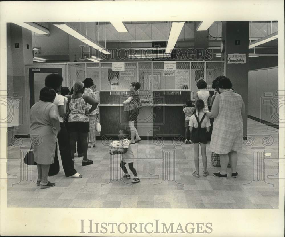 1975, Women and kids waiting at Milwaukee County, Social Services. - Historic Images