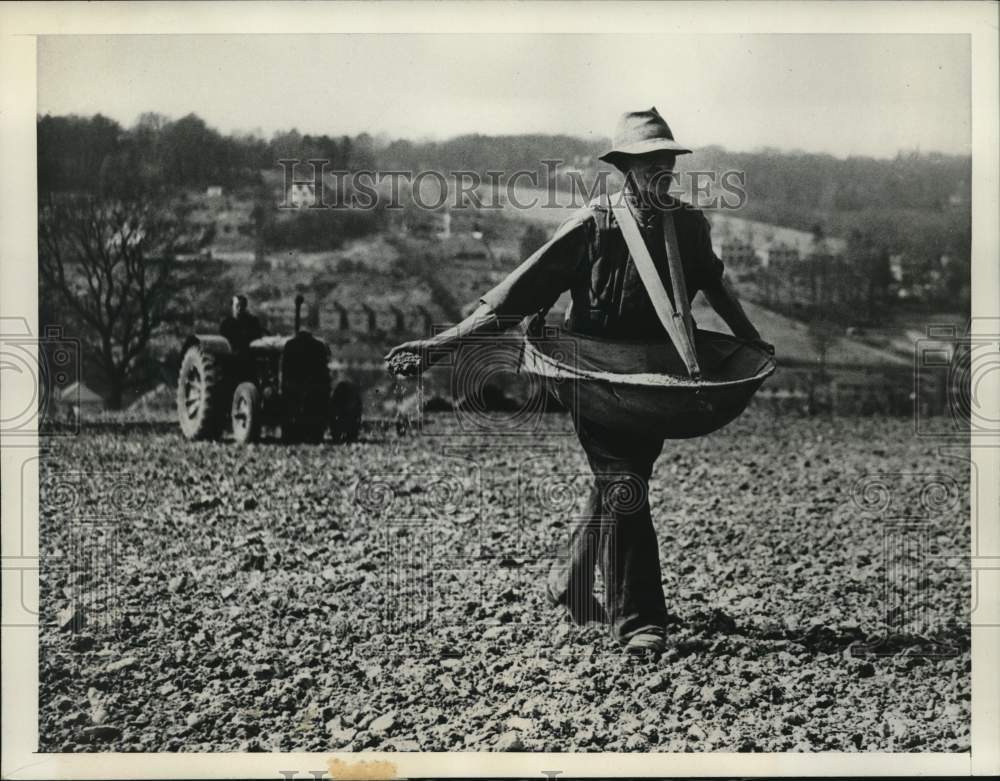 1947, Alfred Cross Spreads Barley Seeds by Hand at Farm in England - Historic Images