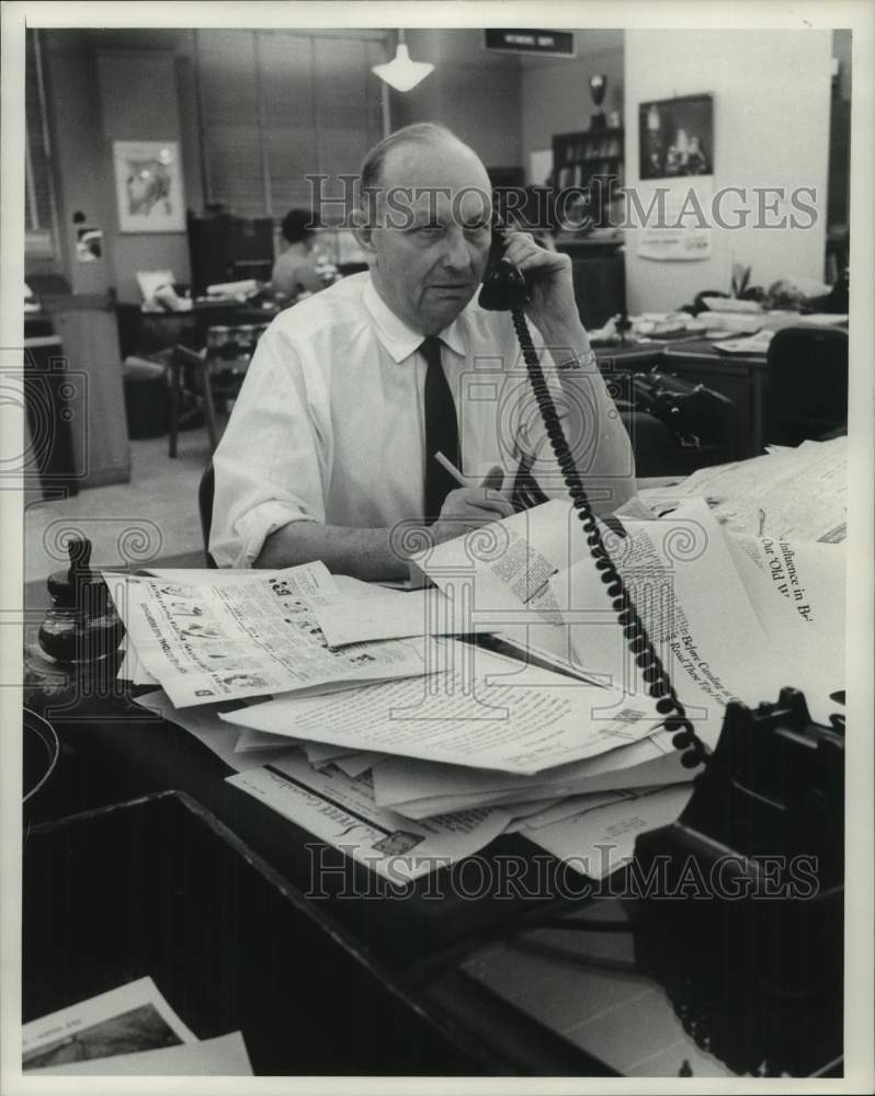 1961, Larry Lawrence is Milwaukee Journal Sentinel Green Sheet Editor - Historic Images