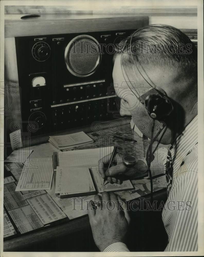 1949, Employee at Milwaukee Journal Sentinel at radio - mje00262 - Historic Images