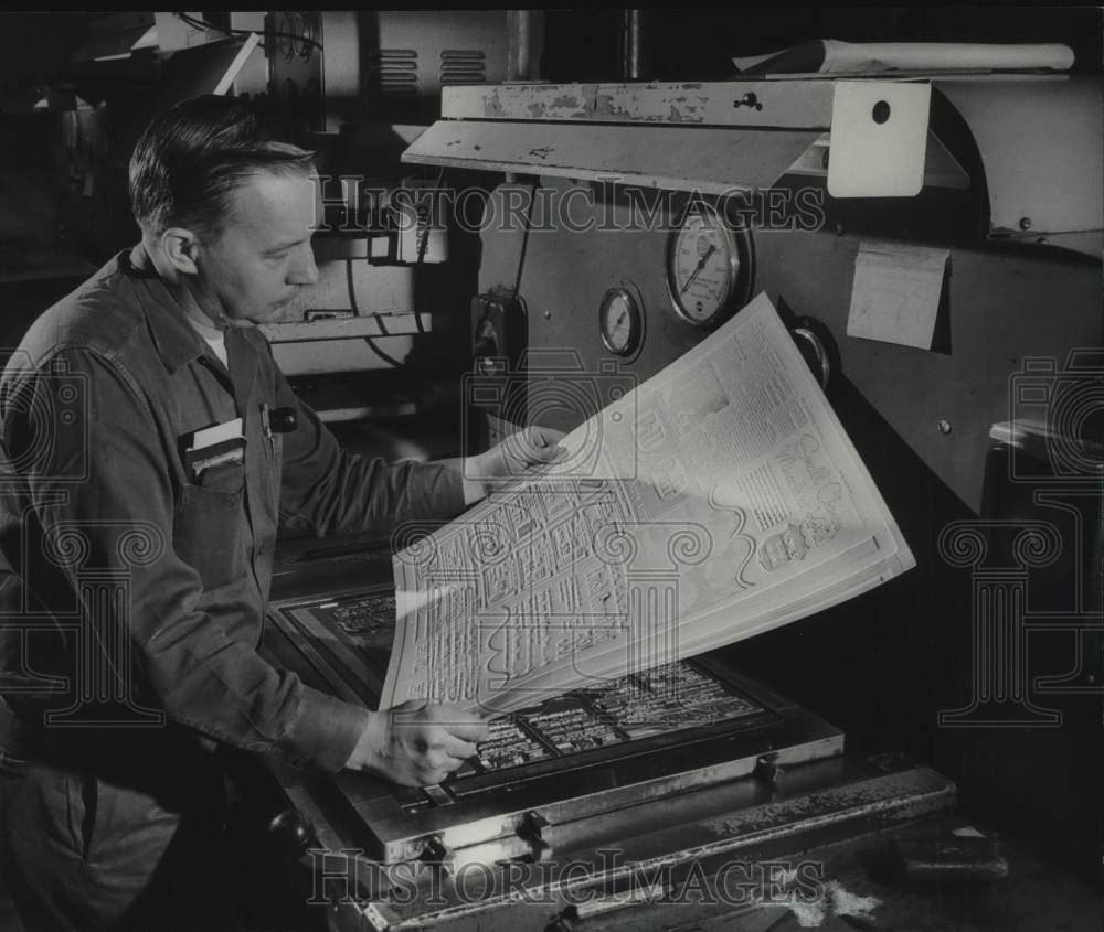 1969, Milwaukee Journal Sentinel employee inspects Stereotype copy - Historic Images