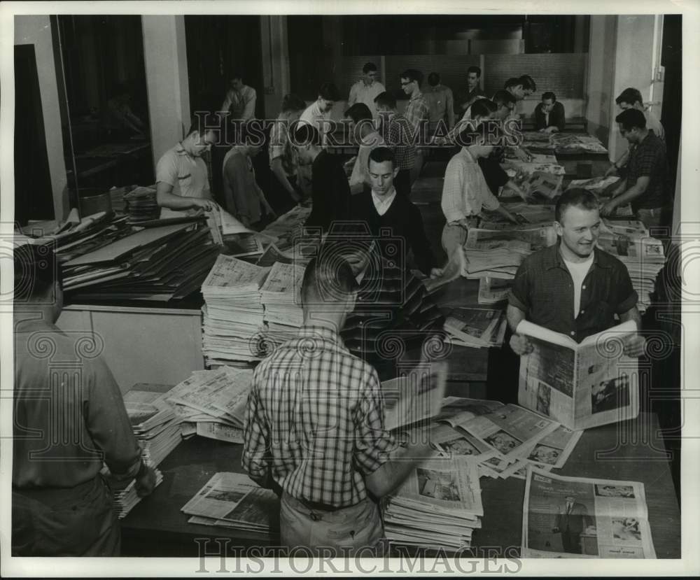 1957 The Milwaukee Journal Employees sorting through newspapers, WI - Historic Images