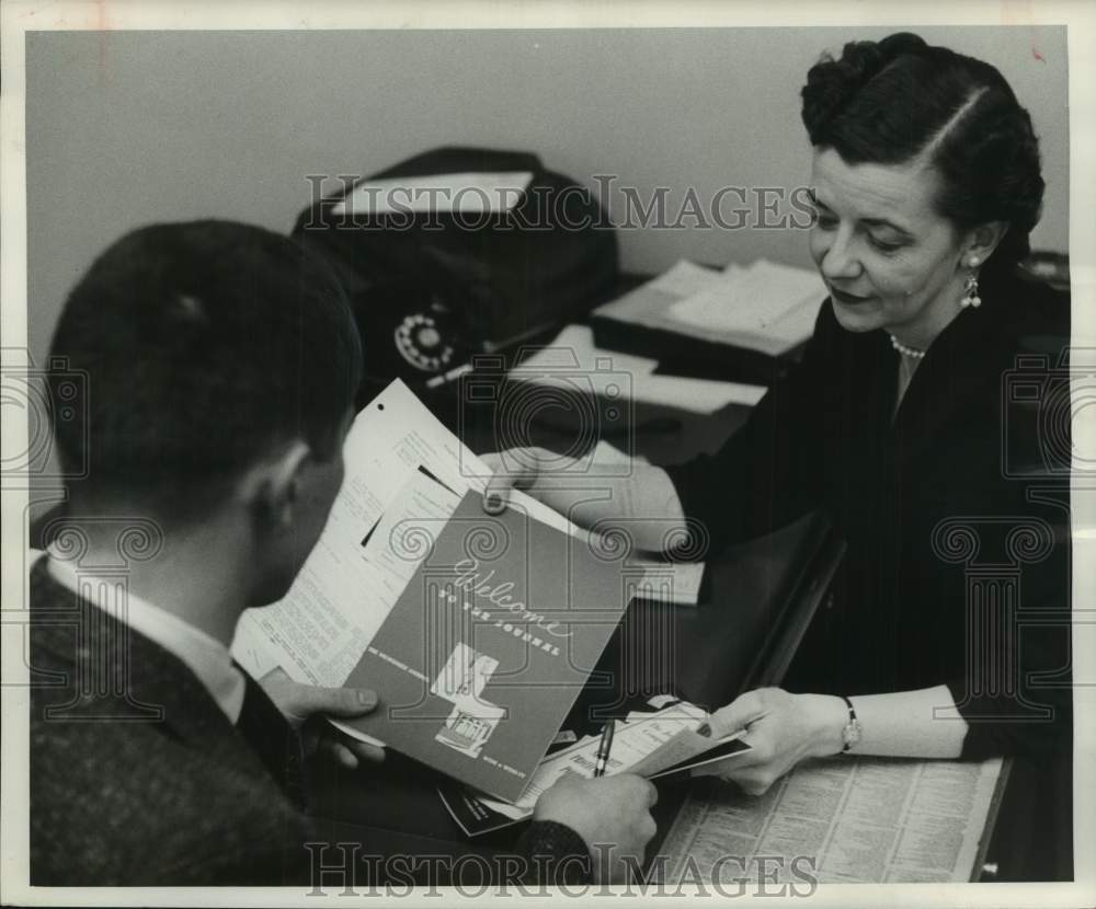 1955, Bernice Vohl welcomes a new Milwaukee Journal employee, WI - Historic Images