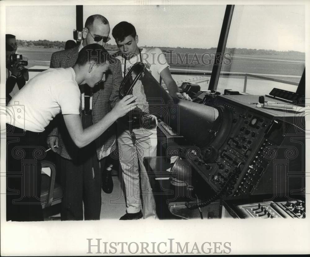 1961, Milwaukee Journal Newsboys peer onto a control room radar, WI - Historic Images