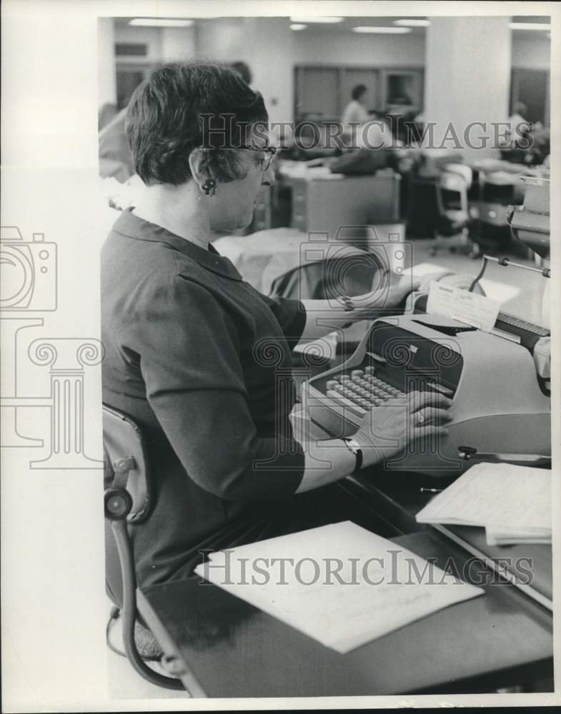 1966, Milwaukee Journal Newspaper worker typing on typewriter, WI - Historic Images
