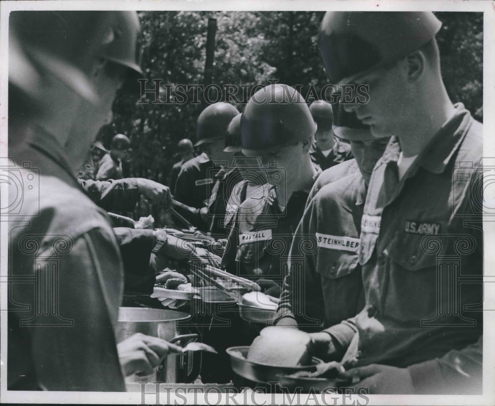 1966 National Guard recruits eating at mobile kitchen in the field - Historic Images