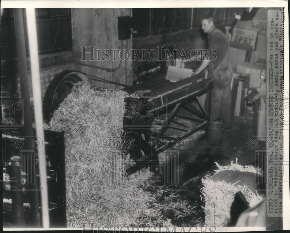 Old ration coupons being shredded into confetti, Cleveland, Ohio - Historic Images