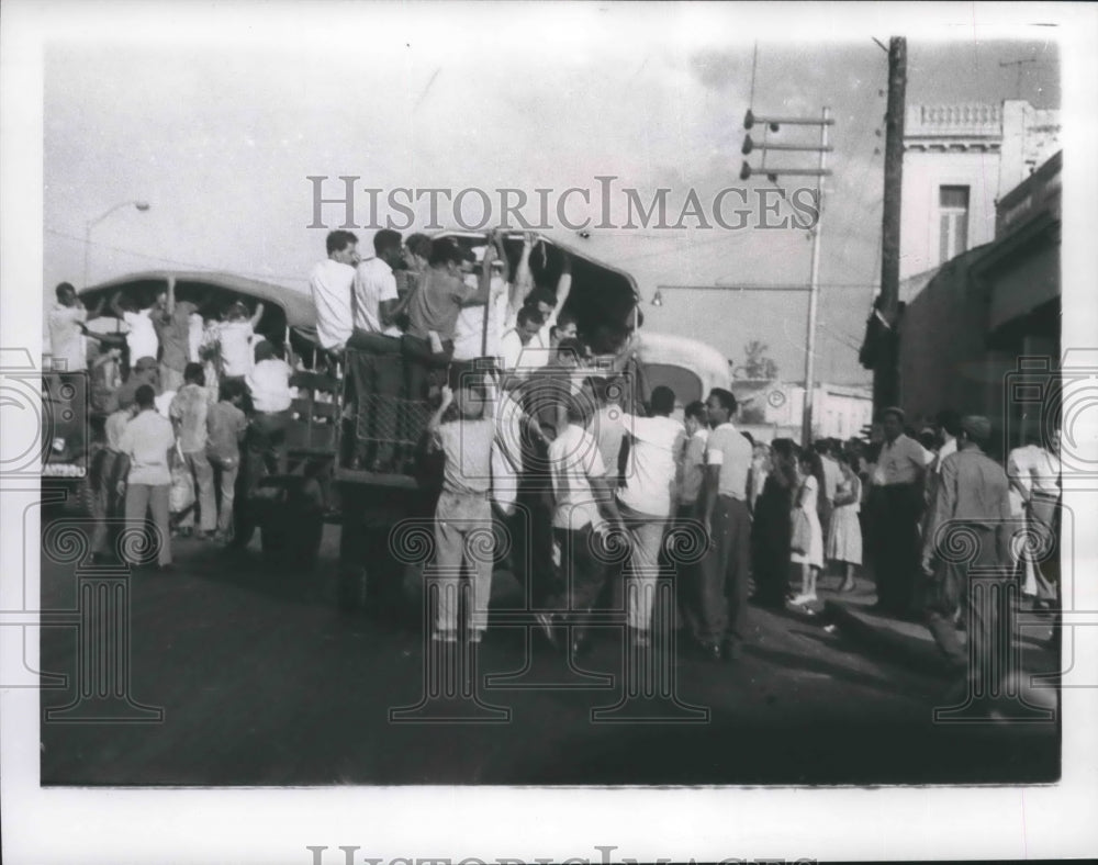 1963 Press Photo Cubans on Russian-made trucks on a street in Havana, Cuba - Historic Images
