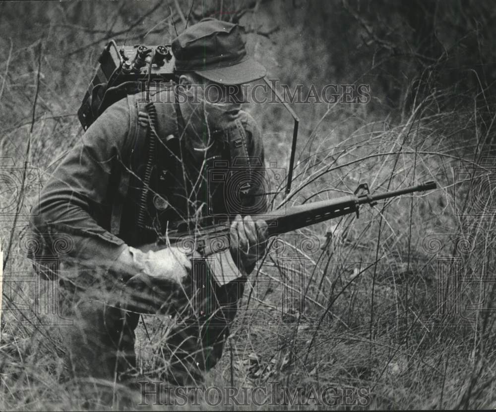 1978 ROTC member Greg Reiff navigates brush, Marquette University - Historic Images