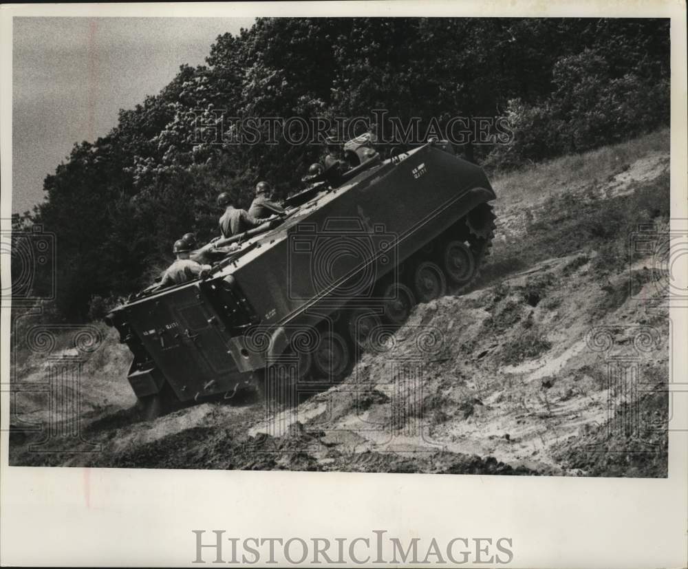 1959 M-84 mortar carrier tank climbs bank at Camp McCoy, Wisconsin - Historic Images