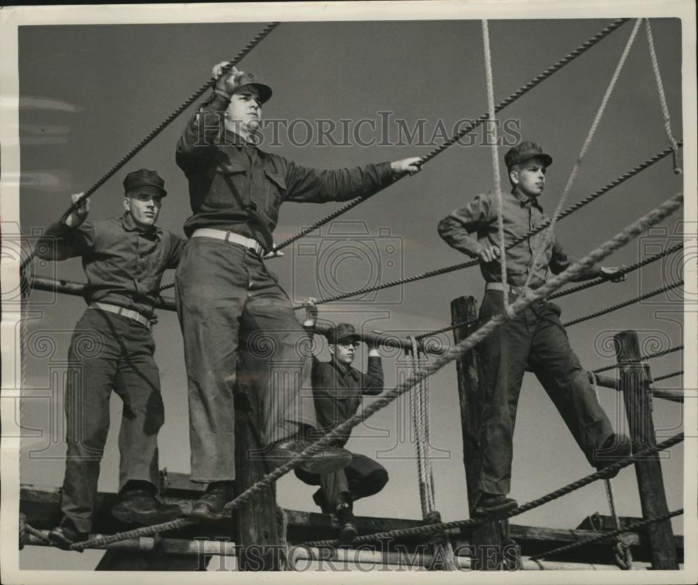 1956 Marines from Milwaukee train on rope bridge on obstacle course - Historic Images