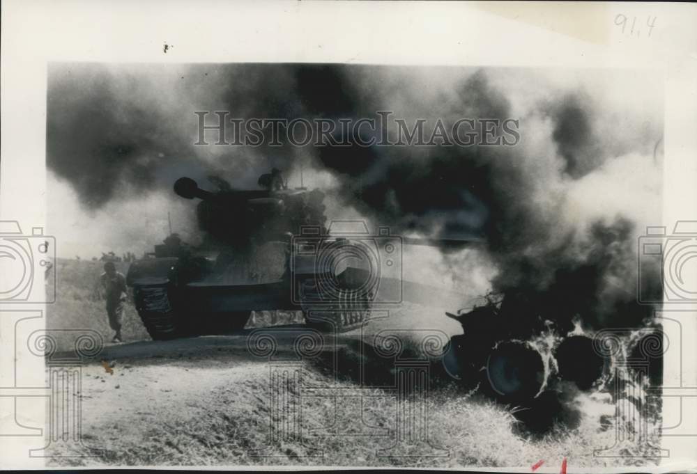 1950 Press Photo Pershing tank moved along highway past smoke of enemy tank - Historic Images