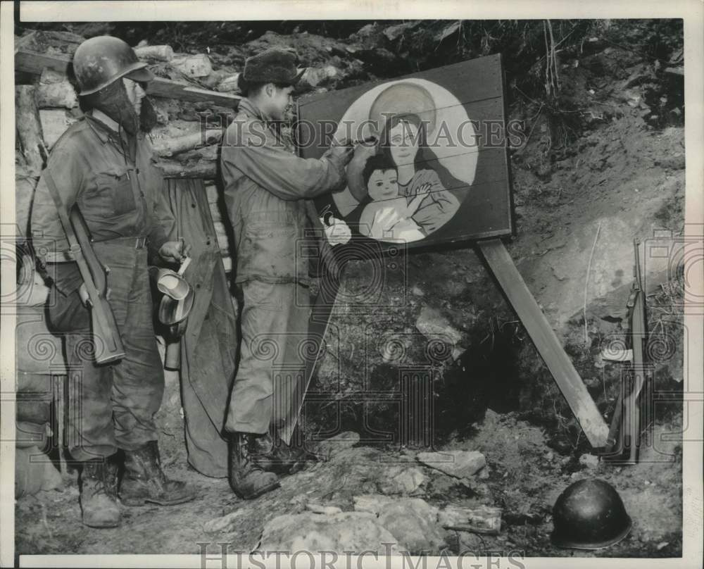 1951 Press Photo Cpl Frank Estrada paints a Madonna during a break in Korea. - Historic Images