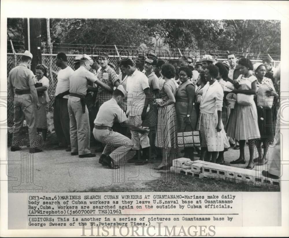 1961 Press Photo Marines search Cuban workers leaving Guantanamo Bay Naval base - Historic Images
