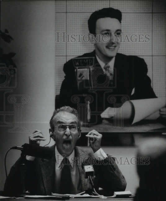 1993, Joe Dorsey Clowns Around in Front of a Poster of Himself. - Historic Images